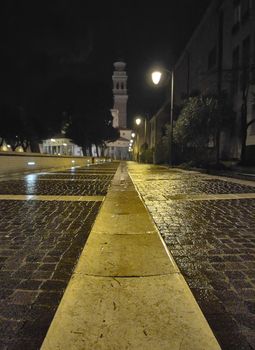 Rovigo alleyway in Italy during night time without people