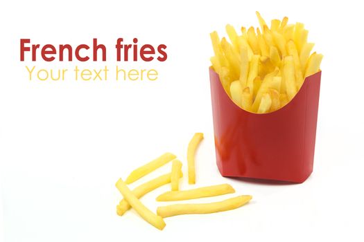French fries in a red carton box in close-up and isolated on white background with copy space place.