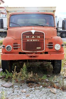 Vintage aged vehicle. Weathered retro rusty truck.