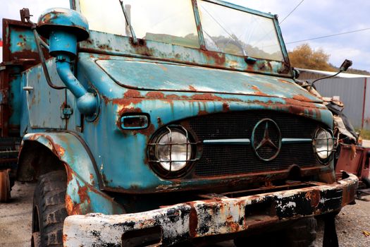 Rusty truck open cabin. Vintage aged vehicle. Weathered retro automobile.
