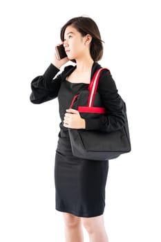 Woman carrying a black shopping bag using cellphone shopping online isolate on white background