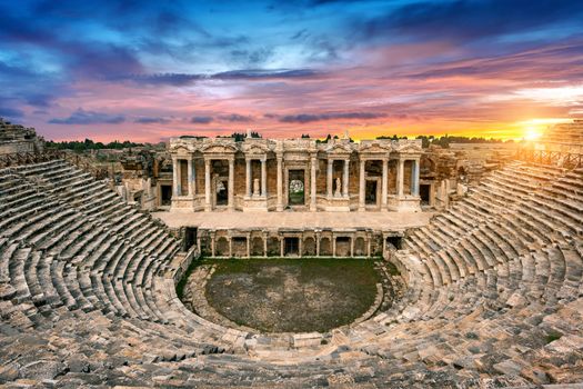 Amphitheater in ancient city of Hierapolis at sunset, Pamukkale in Turkey.
