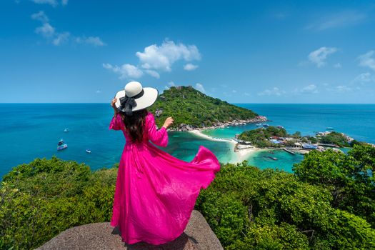 Beautiful girl standing on viewpoint at Koh Nangyuan island near Koh Tao island, Surat Thani in Thailand.