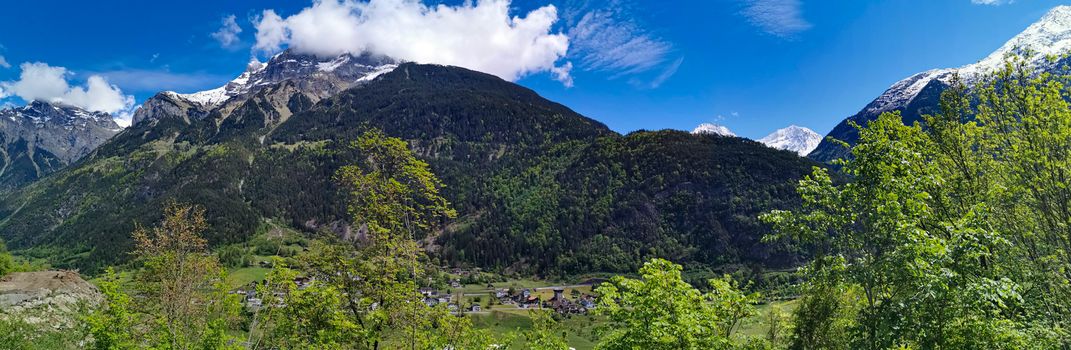 Panorama in canton Uri, Switzerland with swiss Alps and cloudy Sky