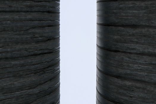 Two metal pipes with clearance background.