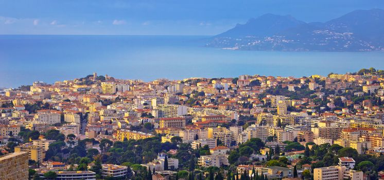 French riviera. Town of Cannes. Panoramic view of Cannes cityscape and seafront from hill, Alpes-Maritimes department of France
