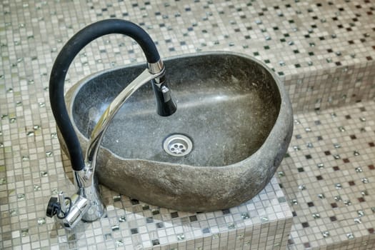 stone sink for pedicure on the floor