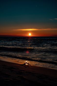 beautiful picturesque calm sunset with colorful clouds on the shores of the Baltic Sea in Poland