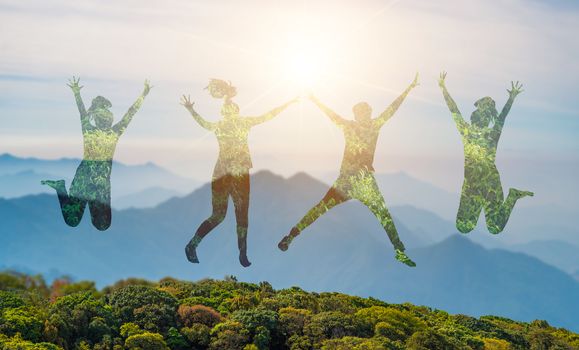 Young people are jumping with joy in the midst of the wild nature.concept Environmental day earth