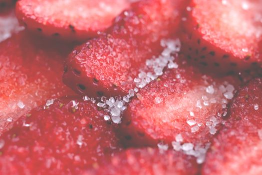 Fresh vitamin berry backdrop. Sliced strawberry in sugar filling background. Red healthy tasty strawberry’s with sugar texture.