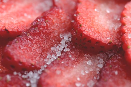 Red healthy tasty strawberry’s with sugar texture. Fresh vitamin berry backdrop. Sliced strawberry in sugar filling background.
