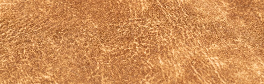 brown faux suede leather for the concept and style idea of fine leather craft, handmade work space. Background textures and Wallpapers.