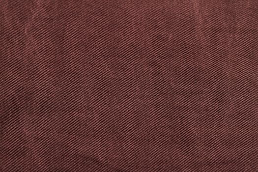 Dark cherry Denim Texture. Denim background of jeans of unusual color, place for text, place for copying.