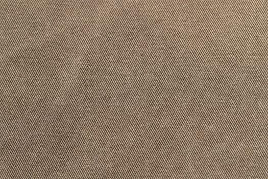Dark olive denim texture. Denim background of jeans of unusual color, place for text, place for copying.