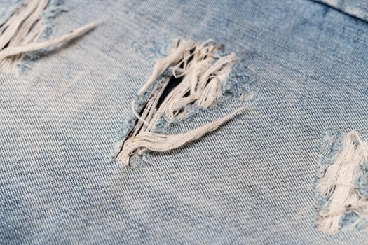 Close-up of blue denim texture. Denim jeans background, space to copy your design or text.