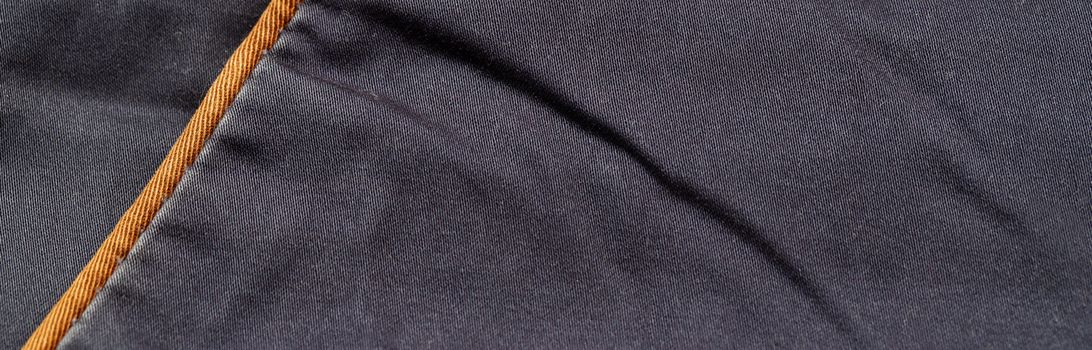 Close-up of blue denim texture. Denim jeans background, space to copy your design or text.