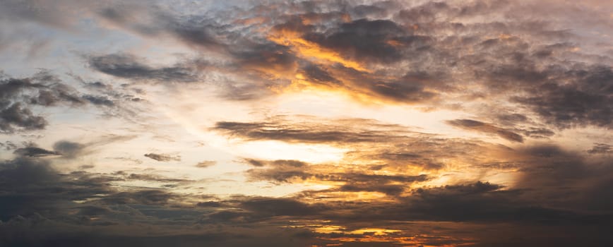 Dramatic sunset clouds on sky in a summer evening