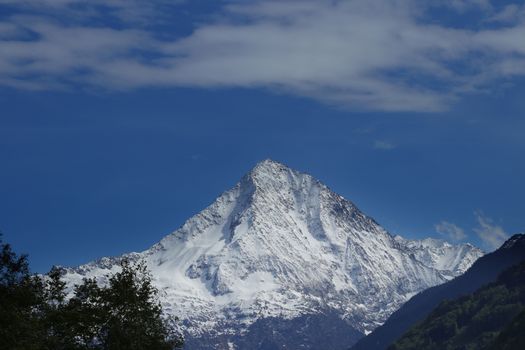 Panorama in canton Uri, Switzerland with swiss Alps and cloudy Sky