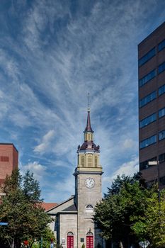 An old Grey Stone Church Steeple and Clock Tower in Portland, Maine