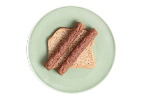 Frikadel on a piece of bread, on a plate, on a plate, a Dutch fast food snack