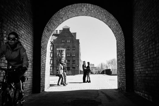 happy guy and girl walking along the tourist streets of old Europe in the city of Gdansk