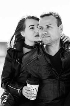 happy guy and girl walking along the tourist streets of old Europe in the city of Gdansk