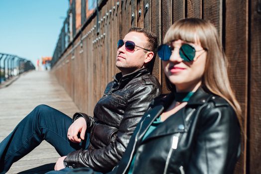 happy guy and girl walking along the tourist streets of old Europe in the city of Gdansk