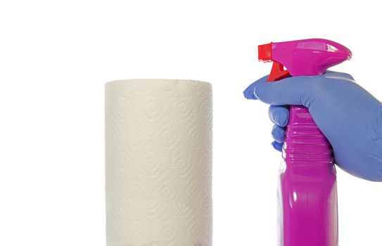 Cleaning supplies on white background like paper roll and hand in glove holding a desinfection spray