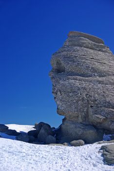 Natural rock formation like a human face in Romanian Carpathians, natural monument