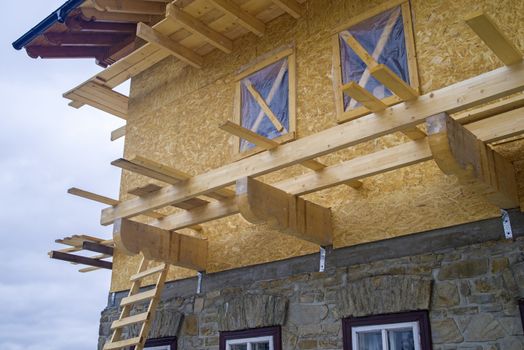 Wooden chalet construction site, exterior working