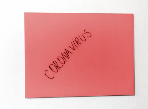 Red coronavirus alert on a board