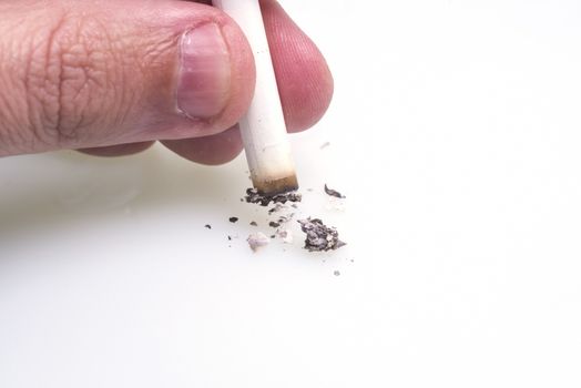 Man hand extinguish a cigarette on white