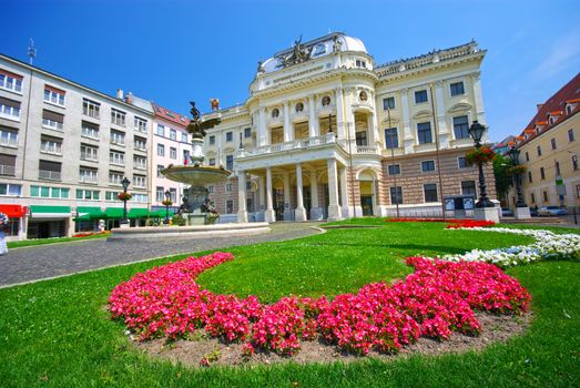 Summer landscape in Bratislava, Natioanl Theatre facade and beautiful flower garden