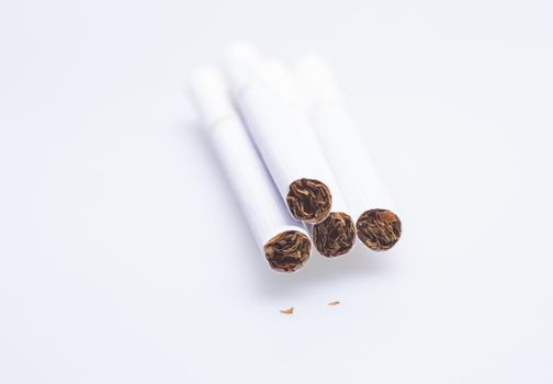 Close up image of white cigarettes on white background