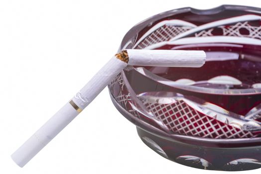 Close image of broken cigarette on ashtray