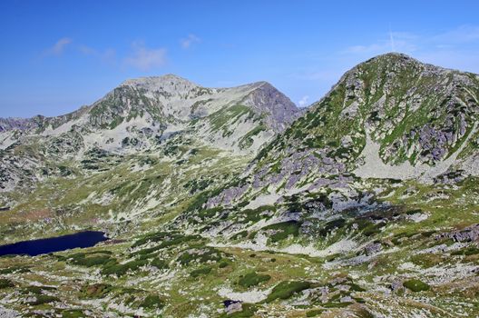 Summer mountain scene in Romanian Carpathians, alpine area and glaciar lake