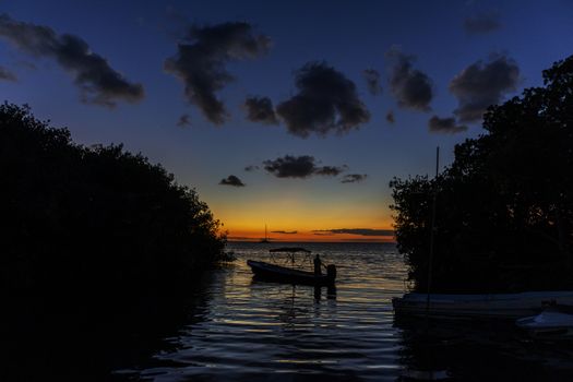 boat at sunset in caye caulker