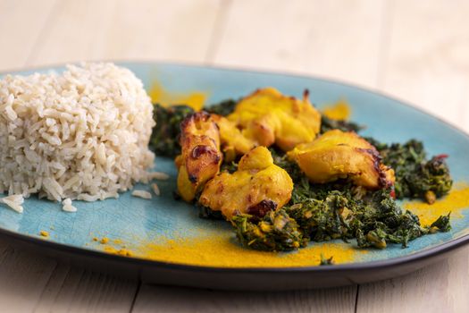 indian murgh palak dish with rice