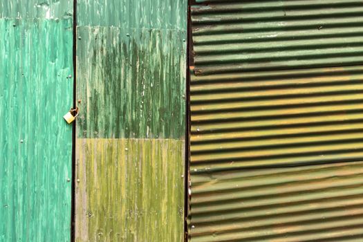 green and yellow corrugated iron as a door