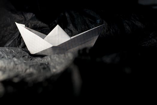 Paper boat on colored backgrounds