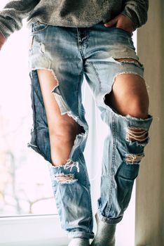 Girl in torn jeans