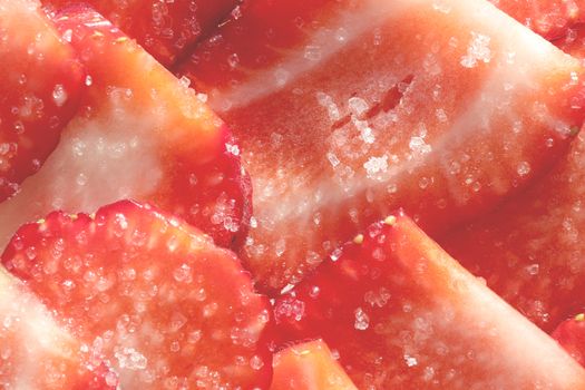 Strawberry with sugar texture. Vitamin berry backdrop. Strawberry slices in sugar filling background.