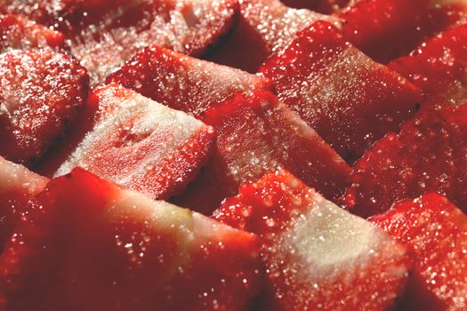 Strawberry with sugar texture. Vitamin berry backdrop. Strawberry slices in sugar filling background.