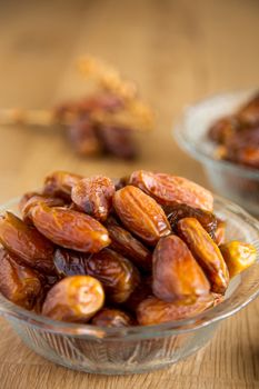 Kurma or dates on wooden background prepared for Ramadan