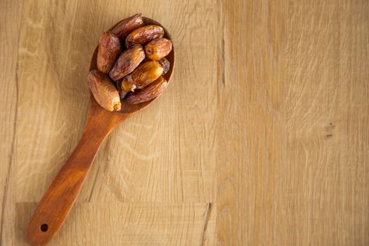 Kurma or dates on wooden background prepared for Ramadan