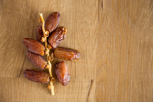 Kurma or dates on wooden background prepared for Ramadan