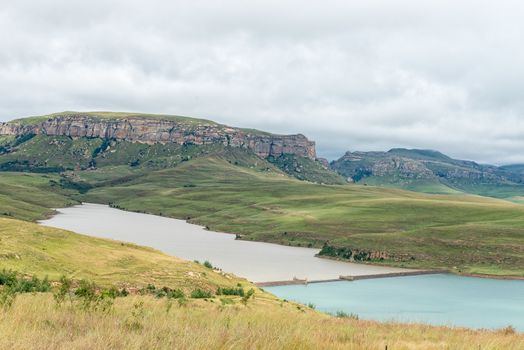 The dam wall of the Driekloof Dam separates its murky water from that of the Sterkfontein Dam