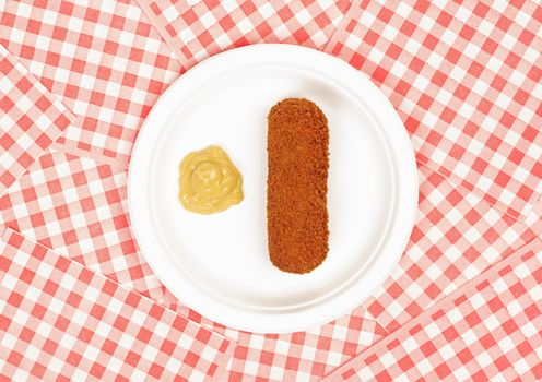 Brown crusty dutch kroket with mustard on a white plate isolated on a white background