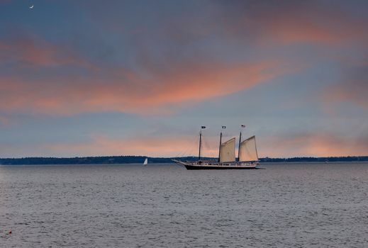 Three masted sailboat flying only two sails