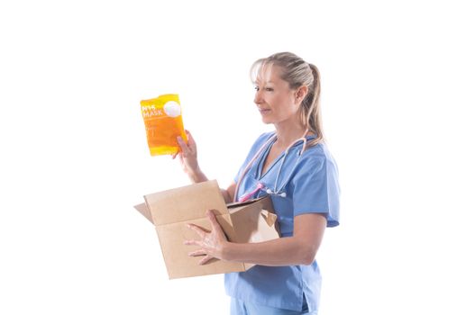 A nurse holds a box of N95 respirator masks part of critical PPE for droplet and aerosol viruses